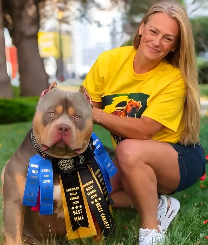 Founder Áurea Giacomelli with LPK Sheik and his championship ribbons